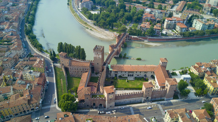 Aerial shooting with the drone of Verona, the city on the Adige river in Veneto, famous for Romeo and Juliet and Shakespeare's play, has been awarded the World Heritage Site by UNESCO because of its urban structure and architectureの写真素材