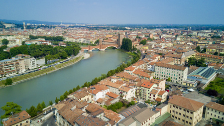 Aerial shooting with the drone of Verona, the city on the Adige river in Veneto, famous for Romeo and Juliet and Shakespeare's play, has been awarded the World Heritage Site by UNESCO because of its urban structure and architectureの写真素材