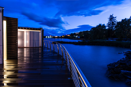 Dusk after the storm on a private wharf of a luxury hotel on Lake Neuchatelのeditorial素材