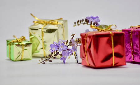 Close-Up Of Purple Petals With Gift Boxesの写真素材