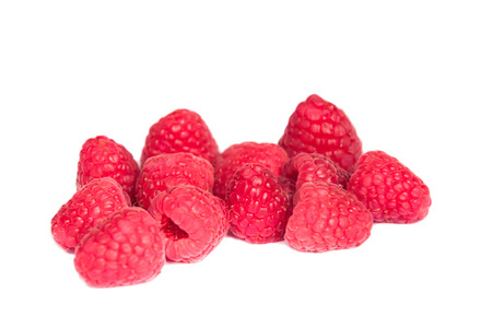 an isolated group of beautiful red raspberriesの写真素材