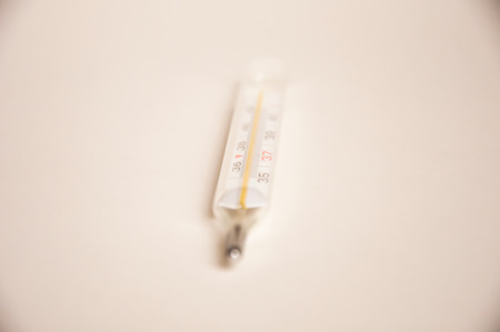 a photo of a thermometer closeup on a light backgroundの写真素材