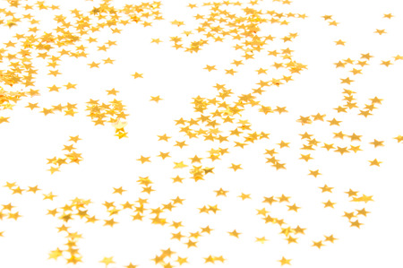 Golden small Stars on a white backgroundの写真素材