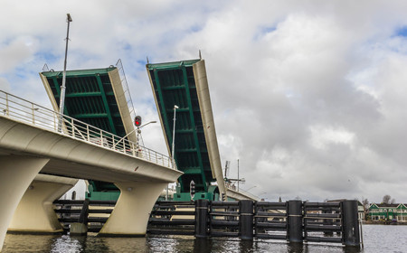 Opening drawbridge over the river in Netherlandsの写真素材