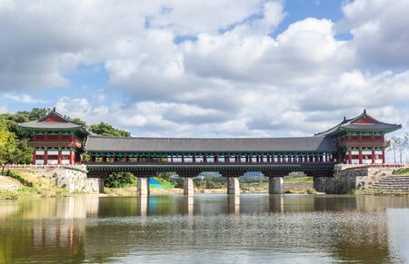 View of Woljeonggyo bridge in traditional Korean style building over the river in Gyeongju, South Koreaの写真素材
