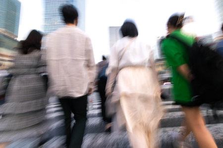 Blur motion of walking people crossing crosswalk in the city, defocusedの写真素材