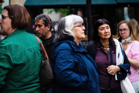 A candid street portrait of diverse group of people urban setting, showcasing various expressionsの素材