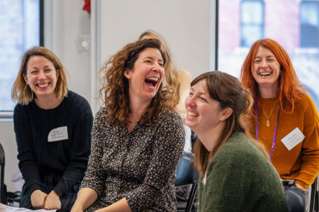 A laughter and joy among group of women during lively gathering, capturing spontaneous momentの素材