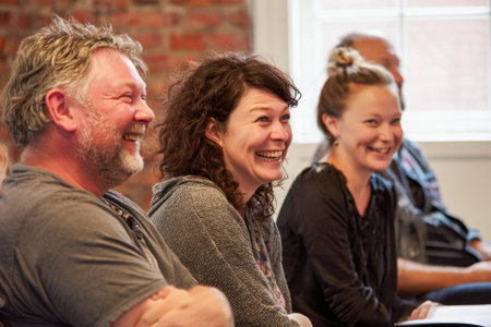 A group laughter during joyful moment in casual setting, showcasing happiness and connectionの素材