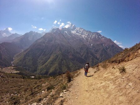 Sagarmatha National Park, Nepal - May 2019: Trekker woman coming back from Everest Base Camp to Lukla, in Nepalのeditorial素材