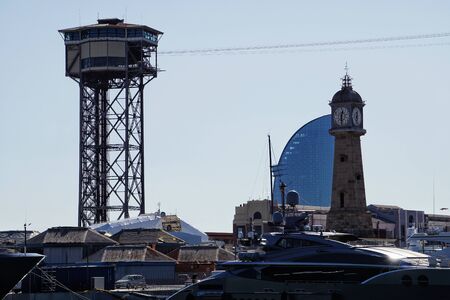 Barcelona, Spain - 26th October 2019: Clock tower and Hotel W in Port of Barcelona, Spainのeditorial素材