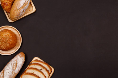 Homemade breads or bun, croissant and bakery ingredients, flour, almond nuts, hazelnuts, eggs on...