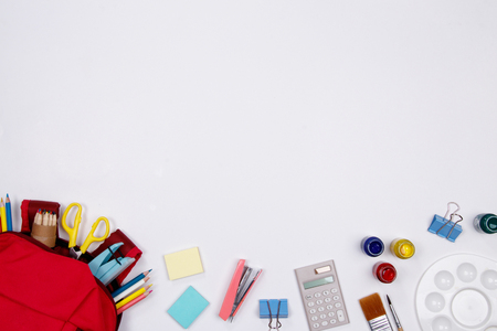 Stationeries and office supplies on white background. Flat lay. Top view with copy space. Back to school concept.の写真素材