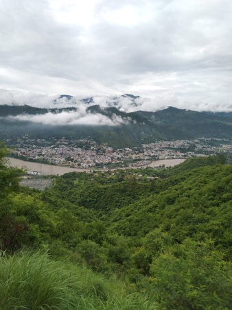 mountains covered trees and blue sky with cloud