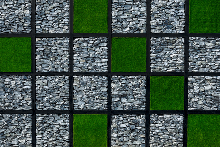 Rock and green artificial grass wallの写真素材