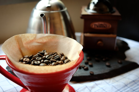 Coffee beans in coffee drip coneの写真素材