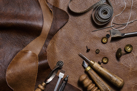 Leather craft or leather working. Pieces of leather and colored leather samples in the craftman's...
