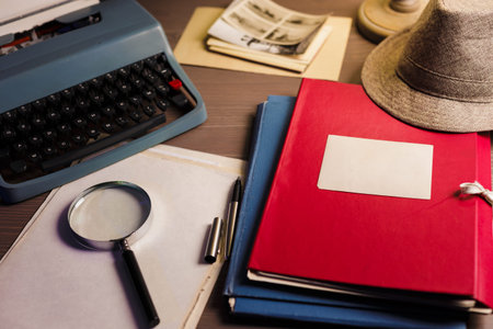 Secret documents investigation concept background with magnifying glass, vintage typewriter and old...