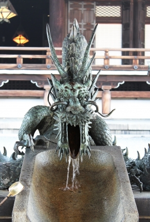 Dragon sculpture at a hand-wash placeの写真素材