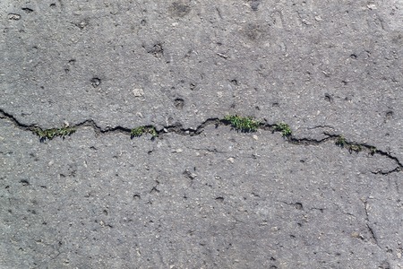 Texture of the old road with cracksの写真素材