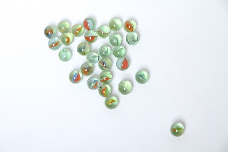 Colored marbles on whiteの写真素材