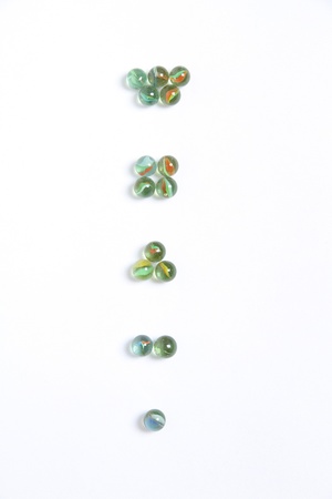 Colored marbles arranged into groupの写真素材