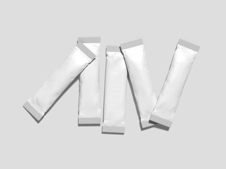 Sachet Packaging Mockup 3D Rendering Showing Five White Rectangular Packets Scattered on a White Background.の写真素材