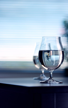 Water in the wine glass on backgroundの写真素材