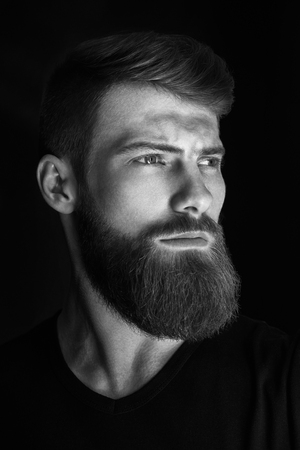 Vertical portrait of a man with beard and modern hairstyleの写真素材