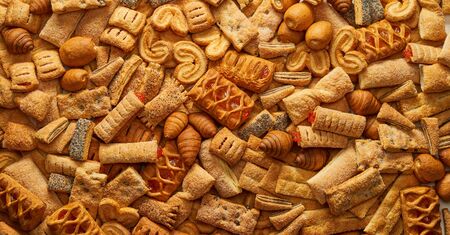 Top view of a variety of cookies Texture background of the cookie in the studio Cookies wallpaper background Backgrounds and textures: group of various cookies Concept of food and pastry products.の写真素材