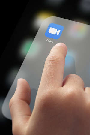 January 5, 2020, Kaliningrad, Russia. Child finger ready to click ZOOM application icon on screen. ZOOM is a very popular application among children and adolescents for distance learning, educationのeditorial素材