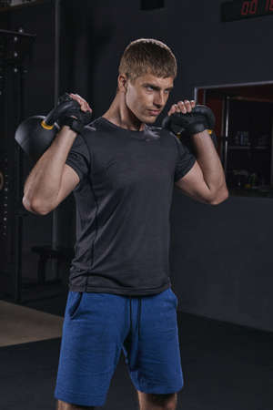Strong Muscular Men, Cross Training Athlete Exercise With Kettlebell.の写真素材