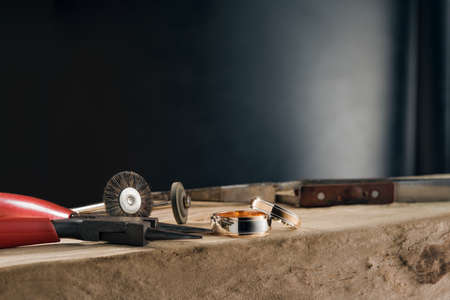 The jeweler polishing tools and two tone rose gold and white gold wedding ringsの写真素材