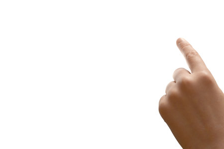 Childs hand, left-handed, pointing index finger upwards, conveying motivation, leadership, and positive communication. Clipping path, Copy free space.の写真素材