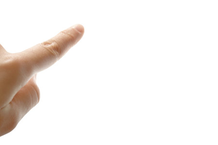 Close-up left hand with the index finger confidently pointing upwards, symbolizing inspiration, guidance, and youthful. Clipping path, Copy free space on right.の写真素材
