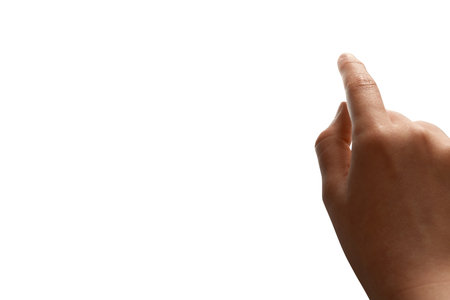 Childs right hand touching screen or something, isolated. Clipping path and copy free space.の写真素材