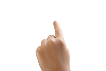 Close up of a kids left hand touching or taping something, finger pointing up. Isolated photo with Clipping path.の写真素材
