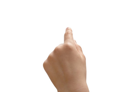 Index finger of a child hand is touching a virtual screen, isolated on white background. Clipping path included.の写真素材
