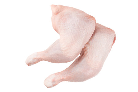 Raw chicken thighs with skin. Raw chicken legs quarters isolated on white background with Clipping path.の写真素材