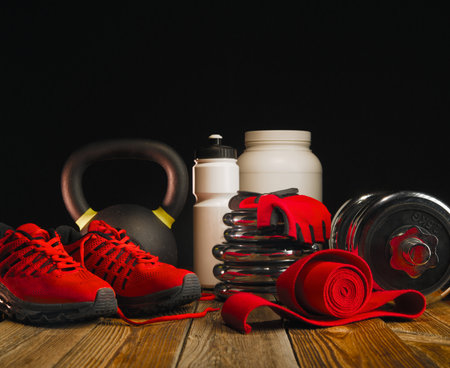Fitness equipment background mockup on dark wooden background.の写真素材