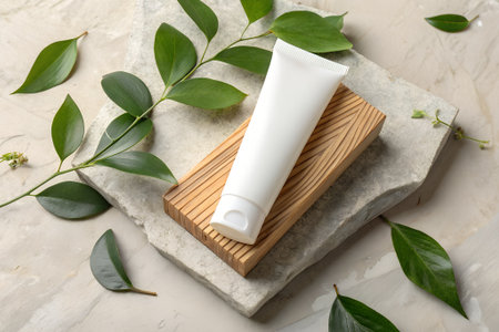 Composition with cosmetic products and green leaves on light textured backgroundの素材