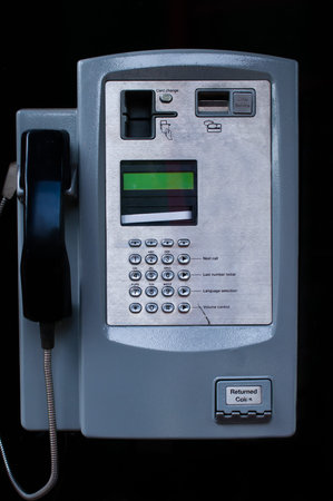 Close up of a Payphone on a black backgroundの写真素材