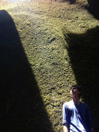 light shining through cracks upon a young manの素材