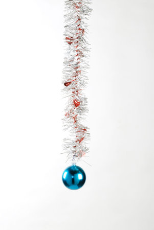 decorative blue ball hanging from a ribbonの写真素材