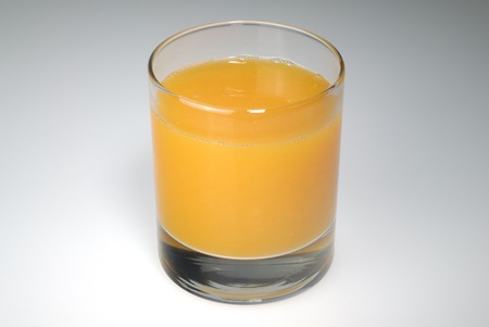 A glass of orange juiceの写真素材