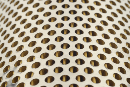 full frame of holes in metalの写真素材