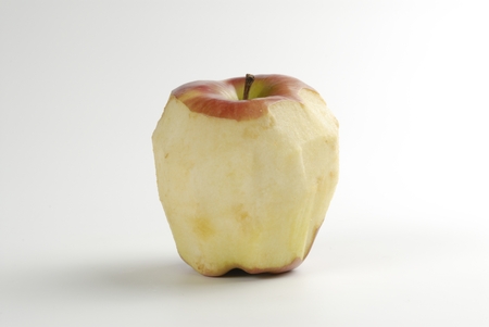 a peeled apple on white backgroundの写真素材