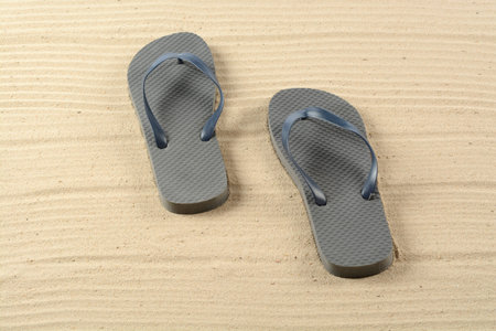 Flip-flops on the sandの写真素材