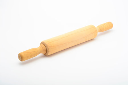 Wooden rolling pin for cooking on white background