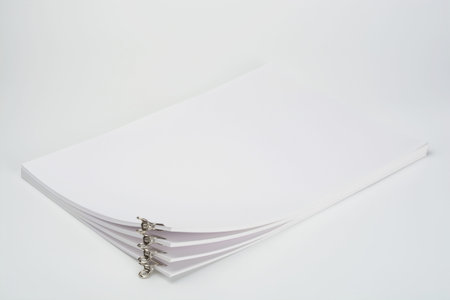 Several documents separated by tweezers